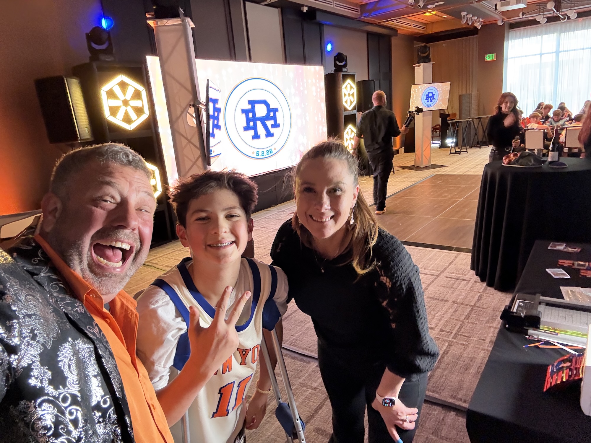 Hank's Basketball Themed Bar Mitzvah Group of people smiling at a basketball-themed event